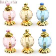 Bottiglie trucco profumo scala